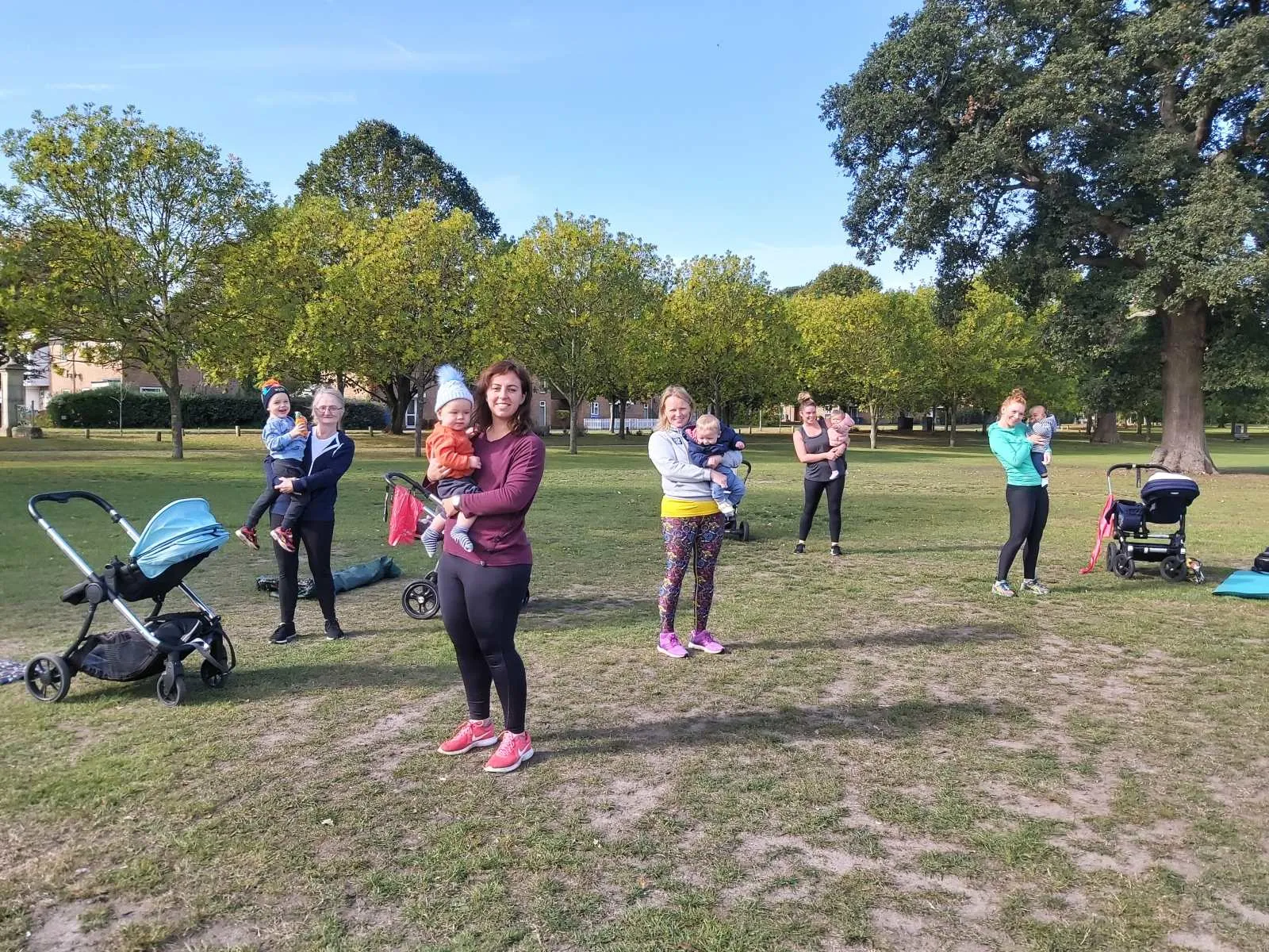 Outdoor small group training session in a Bracknell park with adults, children and babies, Willing Spirit Exercise