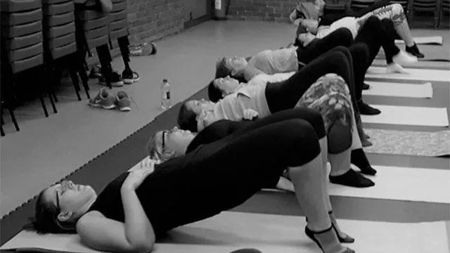 Fitness Pilates class working on mats in a church hall in Bracknell, Willing Spirit Exercise